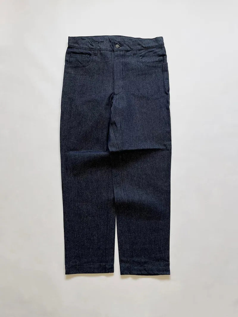 Raw denim supplied to the Italian Navy in the 1990s. High-waisted and slightly tapered. Completely deadstock. Button and zip closure. Size W34 L32.