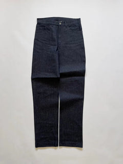 Raw denim supplied to the Italian Navy in the 1990s. High-waisted and slightly tapered. Completely deadstock. Button and zip closure. Size W30 L32.