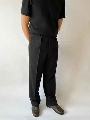 British Army Wool-Blend Trousers (’90s-2000s) – Black wool-blend trousers with a high waist, pleats, and straight-leg cut. Durable, versatile, timeless style.