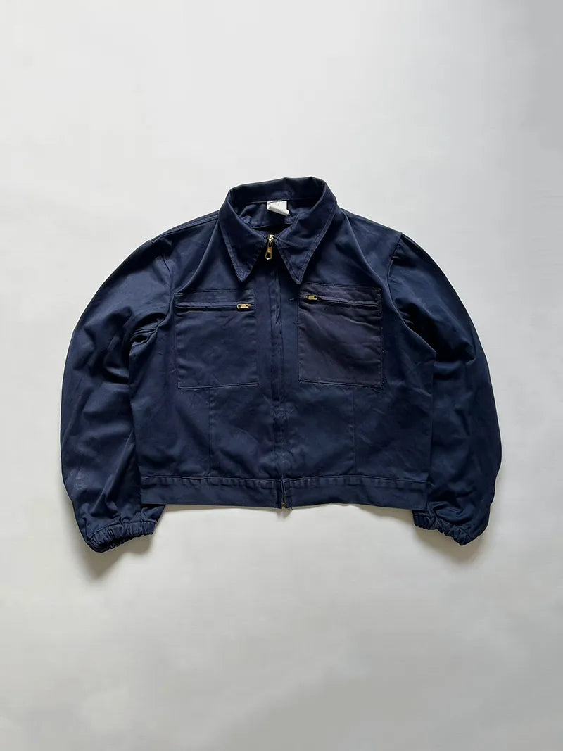 Italian Navy blue work jacket in 100% cotton. Boxy construction with two zip pockets. Made in the 1990s. Deadstock. Removable inner liner. Size Small.