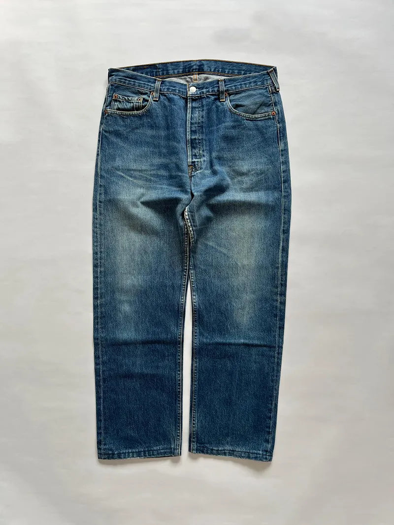 Vintage Levi's 501s in dark blue with beautiful color gradients. Made in France in the 1990s. 