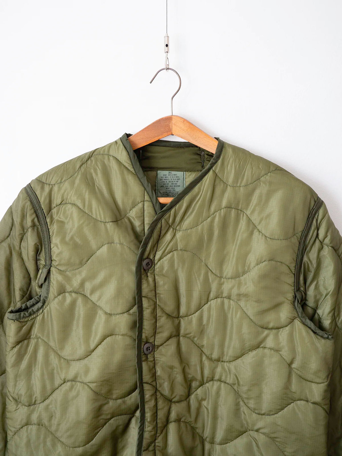 Dettaglio colletto e bottoni del liner M65 taglia Small