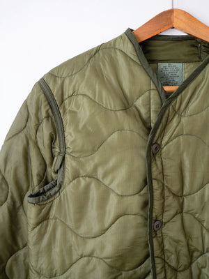 Dettaglio spalla e tasca del liner M65 taglia Small