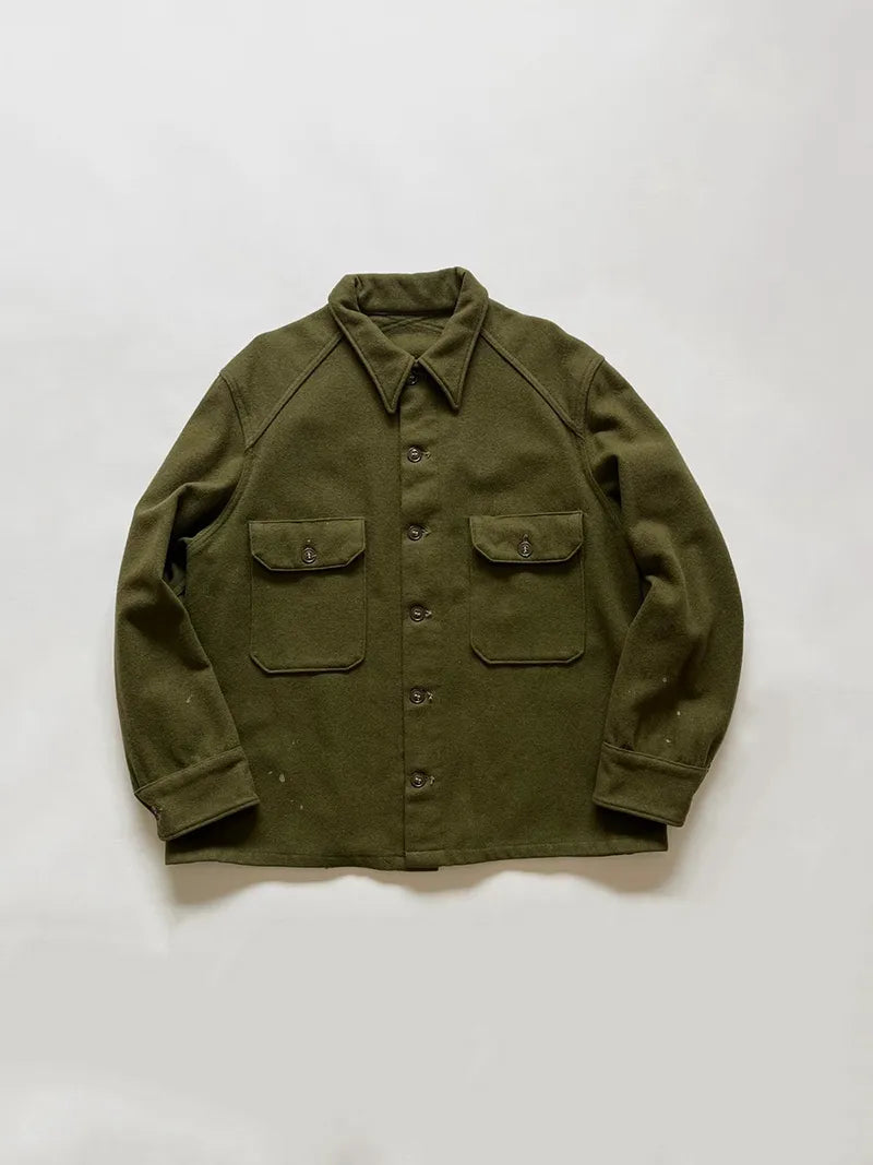 OG 107 US Army wool shirt. Coming directly from the Vietnam War era. Size large. Green color and boxy fit. American army surplus item. Made in USA.