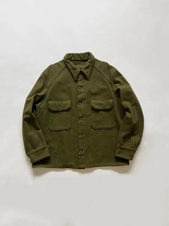 OG 108 US Army wool shirt. Coming directly from the Korean War era. Size large. Green color and boxy fit. American army surplus item. Made in USA.