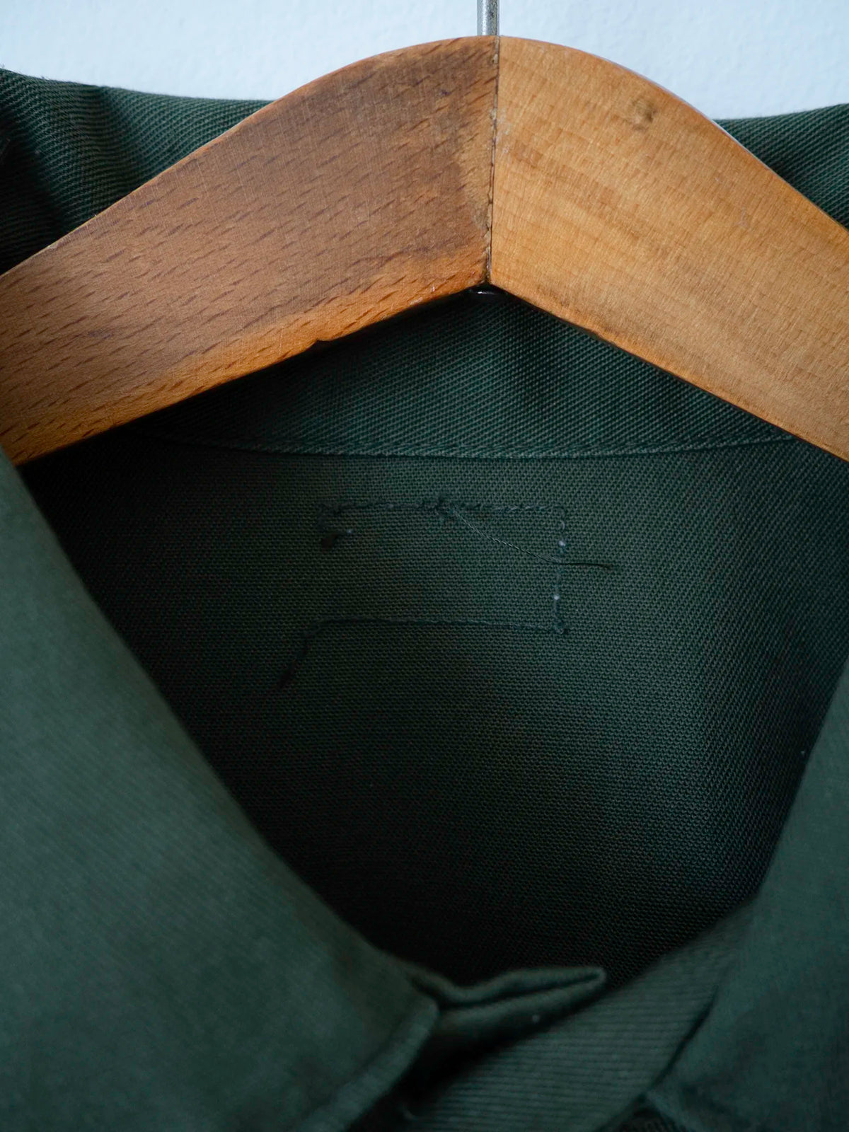 Side view of the plain OG-507 vintage military shirt, size L.