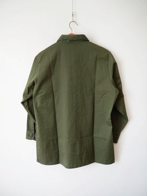 Back view of the OG-507 vintage US Army shirt in deep olive green durable press cotton-polyester.