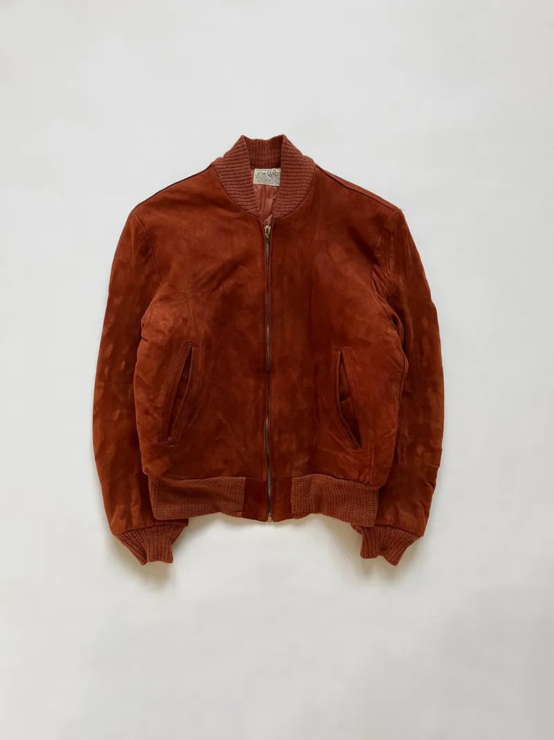 Vintage Suede jacket produced approximately in the 1950s by Dupont Quilon. Made in the USA. Entirely made of suede and lined. Beatiful Conmatic zip. 