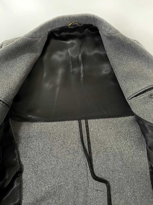 Elegant handcrafted vintage overcoat expertly made in Italy using traditional techniques and high quality materials. Color Melange Gray. Produced in 1990. 