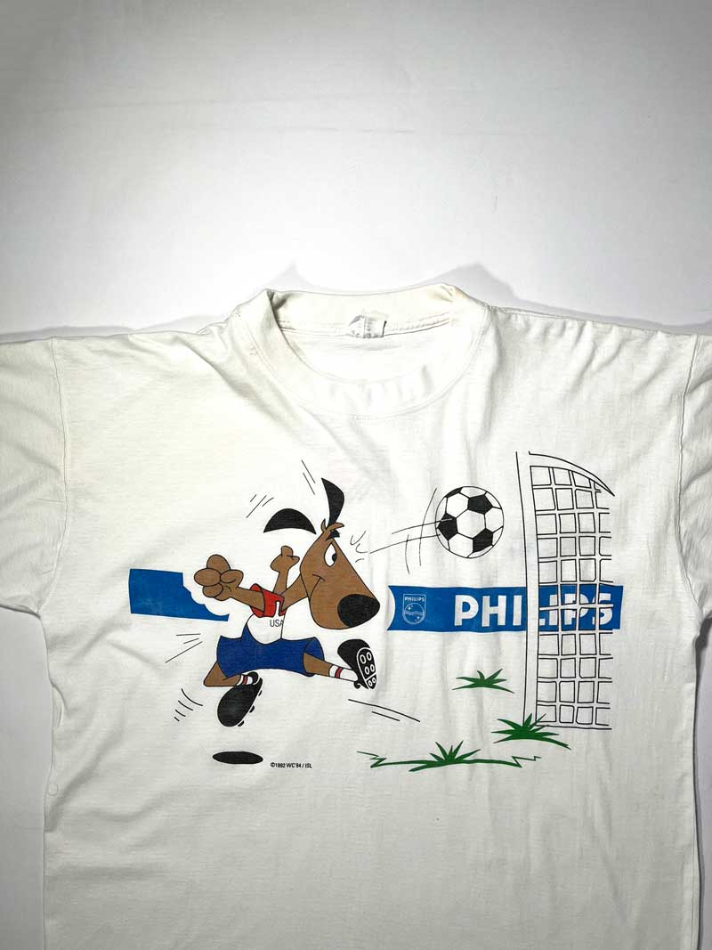 White 90s t-shirt used in the USA94 World Cup depicting mascots. Positioned on a neutral white background.