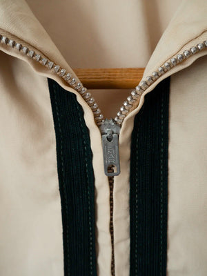 Close-up of the original Emar-branded zipper pull on the vintage Dartmouth College Harrington jacket.