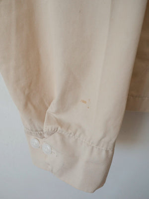 Close-up of the cuff hem showing a small faint stain, one of the minor flaws on this vintage Harrington jacket.