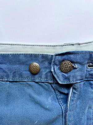 Work pants vintage from 1950s. Color with a fantastic patina given by the passage of time. Vintage work trousers with thick quality fabric. Size 32W 30L.